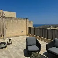 Sea Views Penthouse Apartment, hotel en Xagħra
