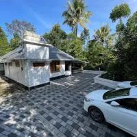 4 Acre Woods Farm Stay, готель у місті Муннар