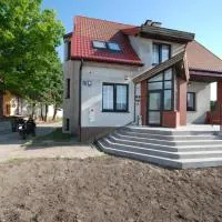 Noclegi Dywity Barczewskiego 27, хотел в Дивити