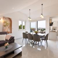 VILLA DOŽDOR - 130 m2 luxury three-room apartments - excellent location near the beach and the town center - view of the sea and the bay - secured free parking, hotel din Milna