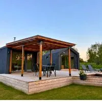 Rātes Krasti - Rasa - holiday house with sauna and lakeview, hotel en Lejasciems