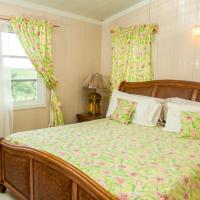 a bedroom with a bed and a window at South Coast Horizon, Curtain Bluff