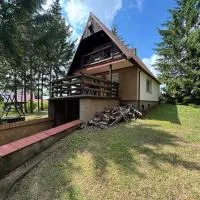 Domek nad jeziorem z własną kładką- raj dla wędkarzy i grzybiarzy, hotel di Orzechowo