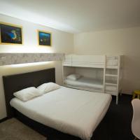 a bedroom with a bed and two bunk beds at hôtel QUICK Palace Tours Nord