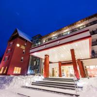a building with snow covered steps in front of it at Hotel TTS**** Spa&Wellness Covasna