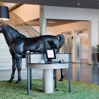 a statue of a horse on a table in a room at Comfort Hotel Bergen Airport