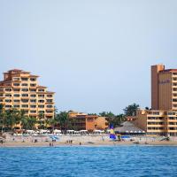 a view of a beach with hotels and buildings at Costa de Oro Beach Hotel, Mazatlán