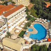 an aerial view of a hotel with a swimming pool at Aloha Hotel, Agios Gordios