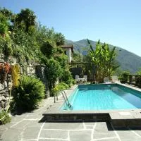 Casa Aries & Studio Aurora - mit Pool, in Cavigliano nur 8 km von Ascona und Locarno entfernt โรงแรมในCavigliano