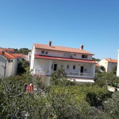 lovely apartments near the town of Rab with Children's pool, playground, garden, parking lot, grill, terraces,