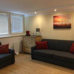 Cosy flat in the quiet area with own garden, free parking and direct public transport link to the centre