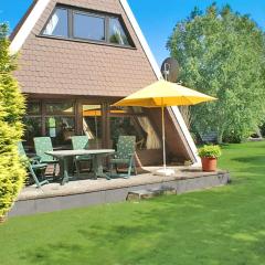 Zeltdachhaus mit TV im Schlafzimme