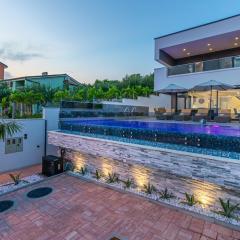 Luxury Villa Lorena with heated pool, jacuzzi,sauna and seaview