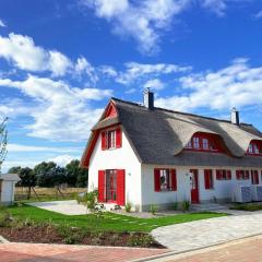 Haus zwischen Mühle und Meer