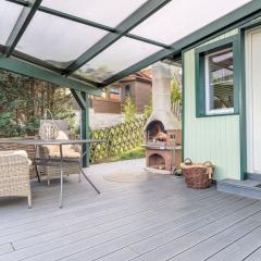 Holiday home with terrace next to the forest