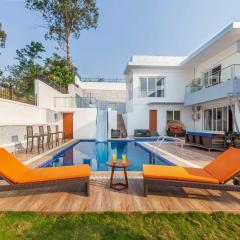 StayVista's White Pebbles - A Villa with Theater Room & Swimming Pool