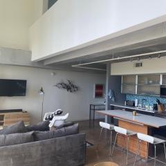Artsy Chic 1BR Condo 30day min with WiFi AC Parking TV Furnished Rooftop