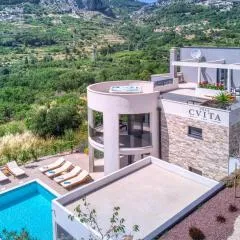 VILLA CVITA is a modern 5-bedroom villa with a Jacuzzi, a Gym and Finnish Sauna, a heated pool, and amazing views