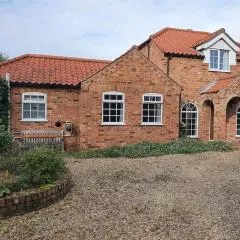 willow tree farm cottage with BBQ hut