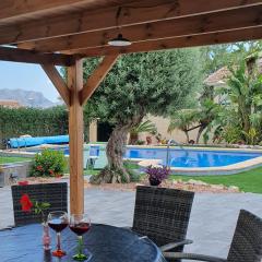 Villa with serene mountain views. Spacious garden with 10x5m pool.