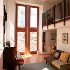 Central Mezzanine Apartment in Historic School