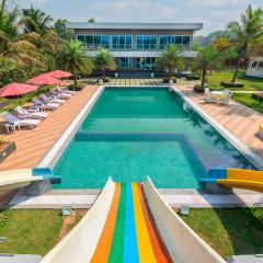 SaffronStays Palm Paradise, Kalyan Khadavli - swimming pool with water slides, gazebo and indoor games
