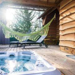 Charmante Cabane dans les arbres avec jacuzzi et sauna