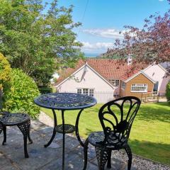 Spacious family & dog friendly home from home with sea views and private garden