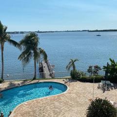 Waterfront condo with Breath taking sunset views/Pool and hot tub