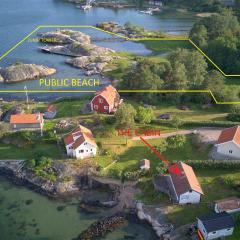 Holiday house with sea views and private beach on Tjorn