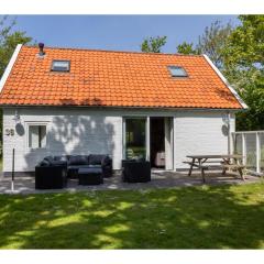 Holiday home in the middle of the wooded dune landscape close to the beach