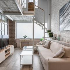Bright duplex loft next to the city center by REMS