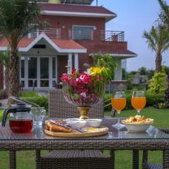 StayVista at Hillside Paradise 4BHK Villa with Jacuzzi, kids play area, view of Aravalli Hills