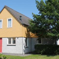 Spacious holiday home with sauna on a holiday park only 200m away from the beach