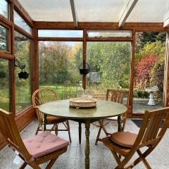 House with a magical garden and sunroom