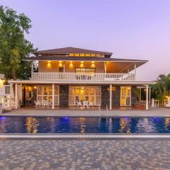 StayVista's Lake La Vie - Tranquil Lake-View Villa Amidst Farmland with Pool and Poolside Gazebo - Proximity to Sula