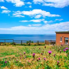 Sunset sea view chalet with hot tub