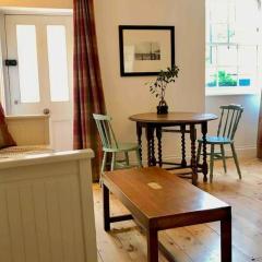 Beachfront apartment with wood burner & courtyard