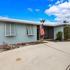 Home on water with pool/lanai kitchen/walk to beach