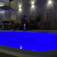 Casa com piscina e um quarto com ar split pé na areia a 50 metros da praia