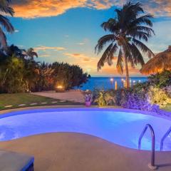 Oceanfront villa with private beach, heated pool, tiki and boat dock