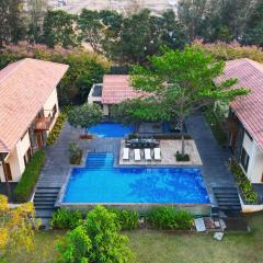 SaffronStays Courtyard, Nashik - infinity pool villa with a huge party lawn