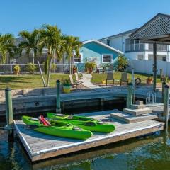 Pirates Den a 4BR Pet-Friendly Waterfront Oasis with Pool, Dock, Personal Water Boats, Fire Pit, Game Room and Bar