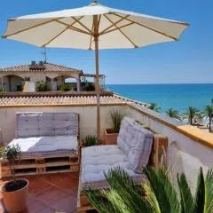 Cal SalMaré seafront apartment with rooftop terrace and pool