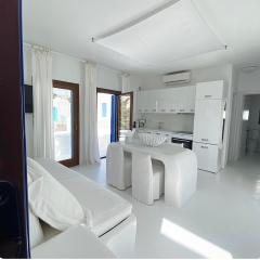 White luxury suite with shared pool downtown by Mykonos Eight