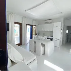 White luxury suite with shared pool downtown by Mykonos Eight