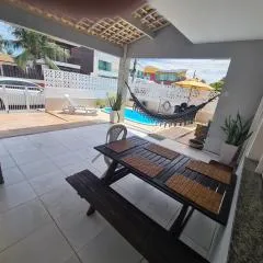 Casa em frente à praia em condominio