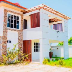 Lovely 4 Bedroom House with Solar Power Security Cameras WiFi and Pergola near Devtraco Court Community 25 Tema