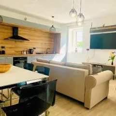 Modern Apartment with Fireplace & Stylish Kitchen