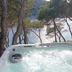 Apartment by the sea Žirje with private heated hydromassage pool